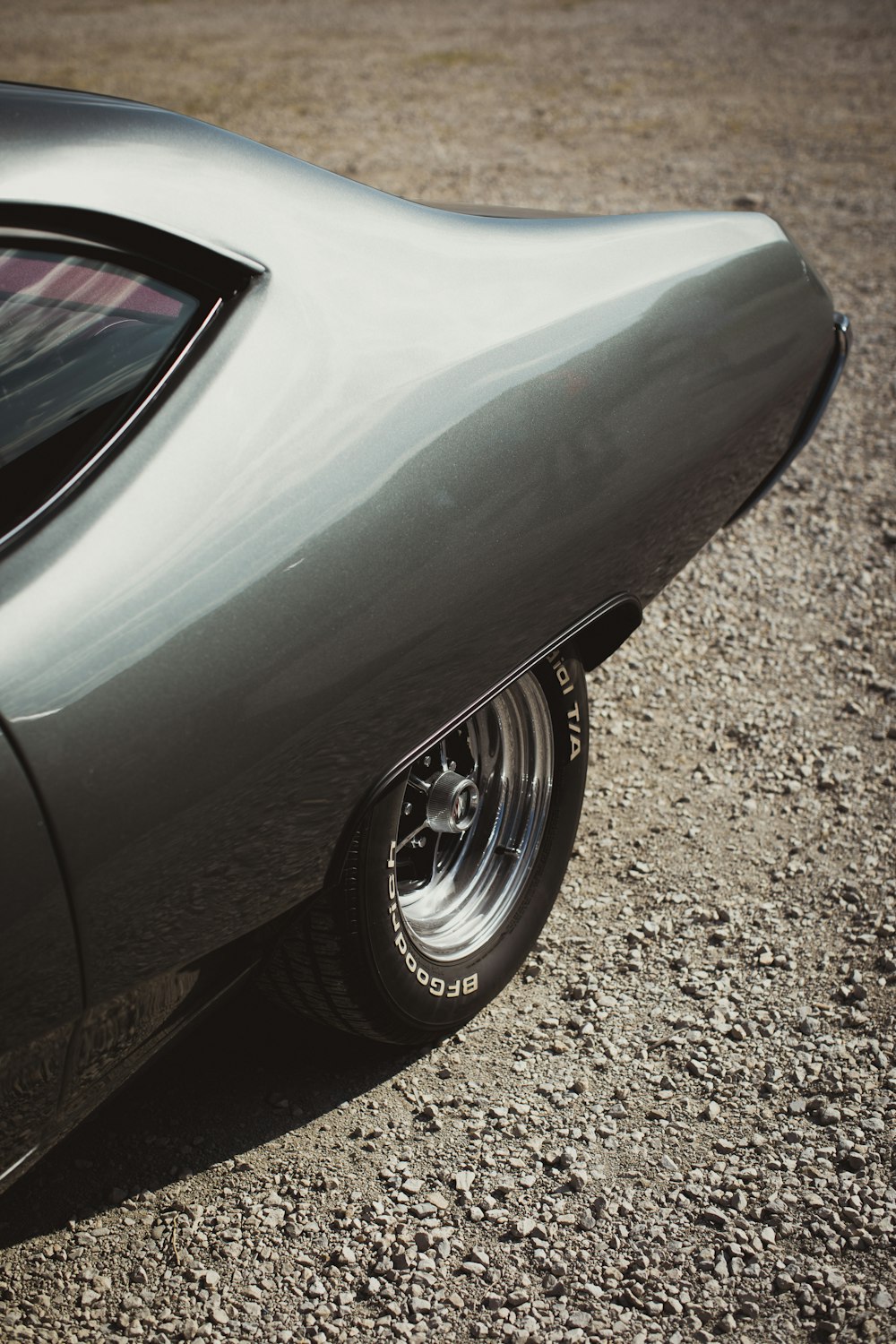 a car parked on gravel