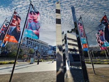 An image displaying colorful banners hanging at an event.