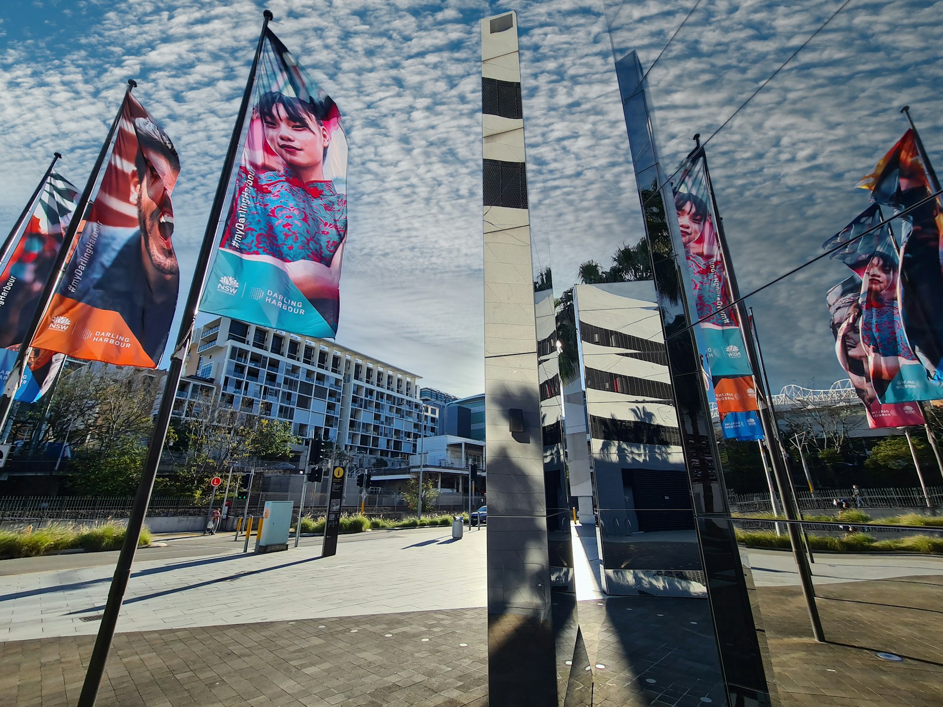 woman wearing yellow long-sleeved dress under white clouds and blue sky during daytime