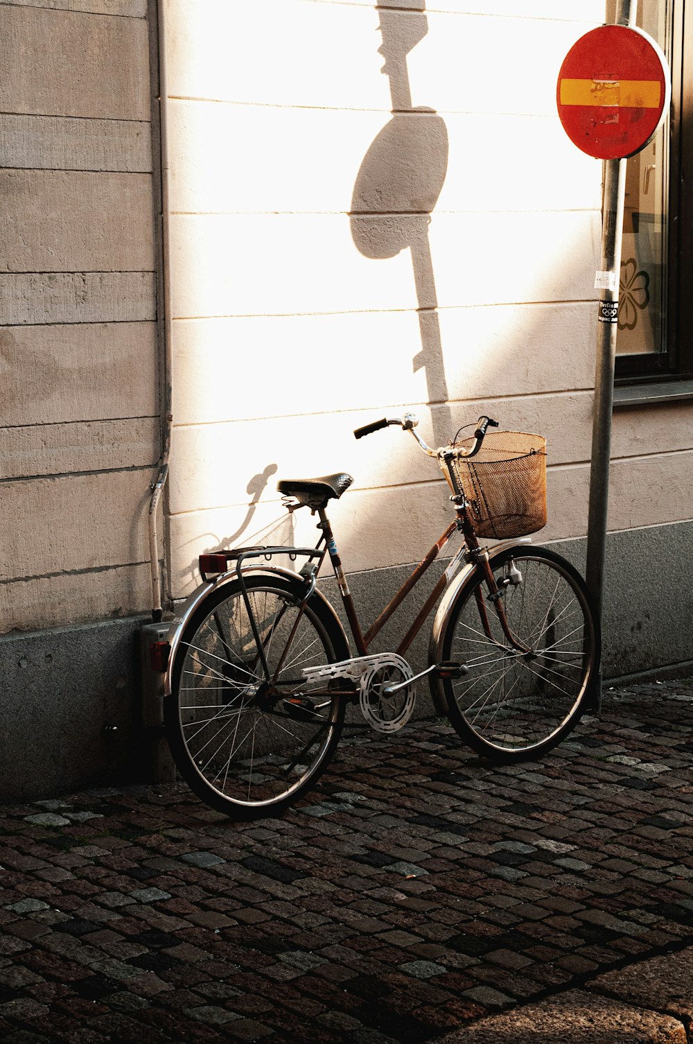 a bicycle is parked on the side of a street