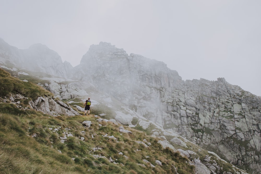 a person standing on a rocky hill