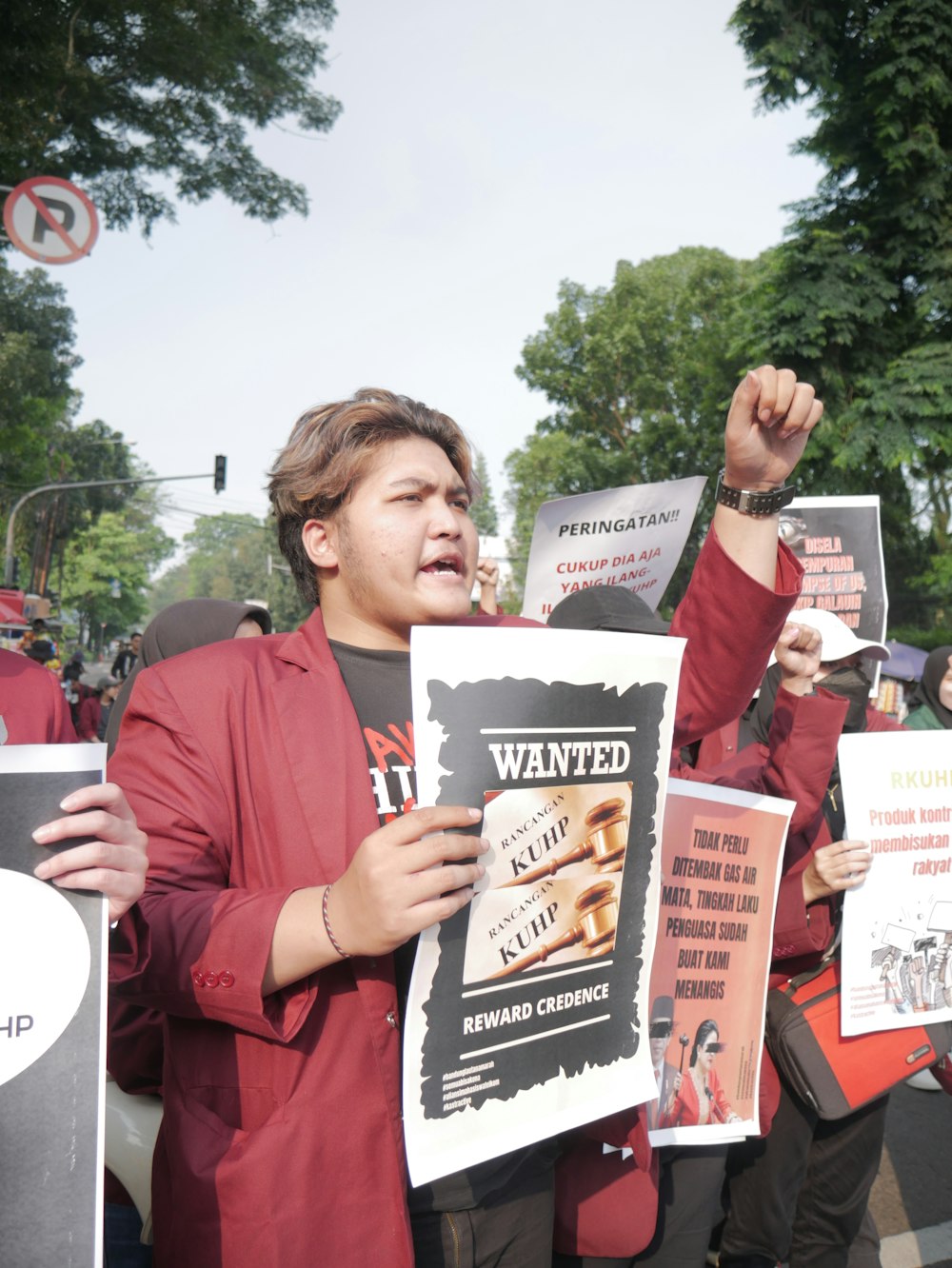 a person holding up signs