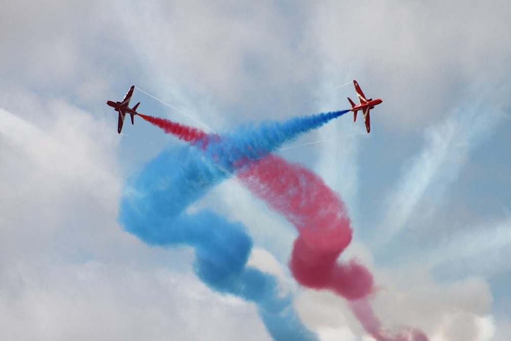 two airplanes flying in formation