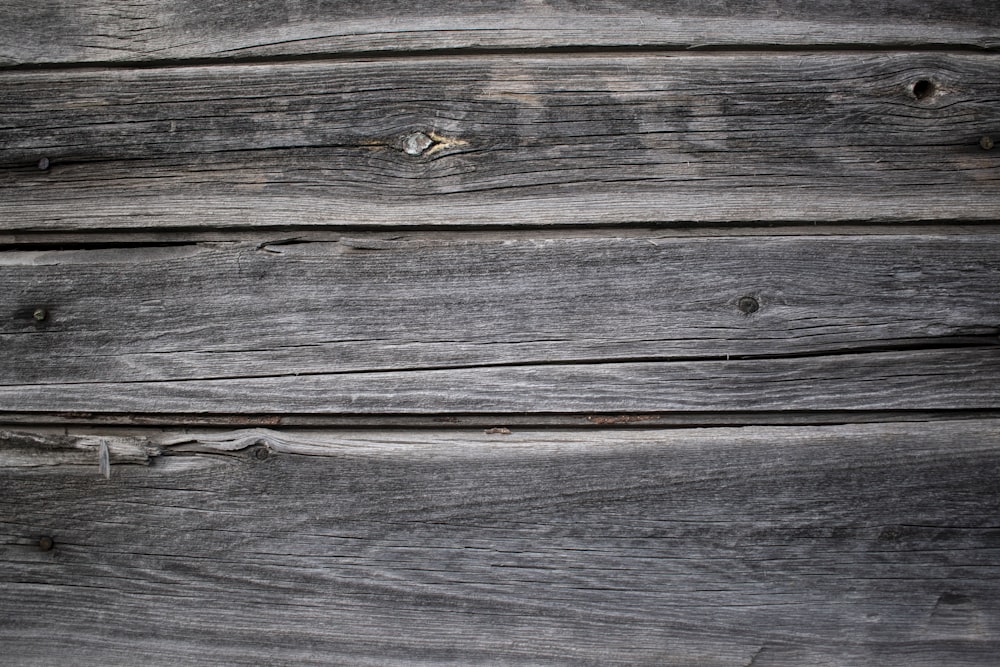 a wood surface with small holes