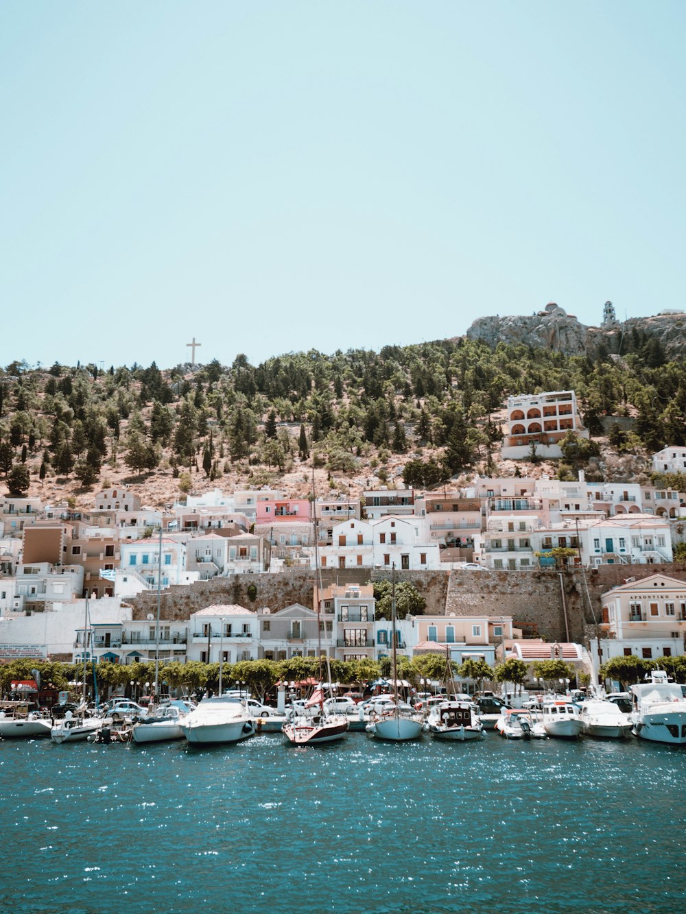 a body of water with boats in it and buildings around it