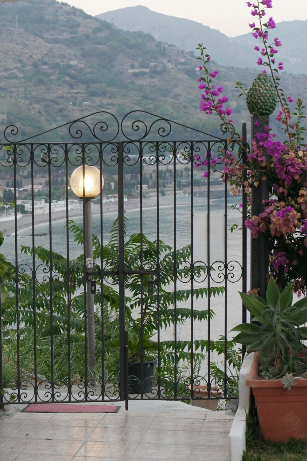 a balcony with a view of a valley and mountains