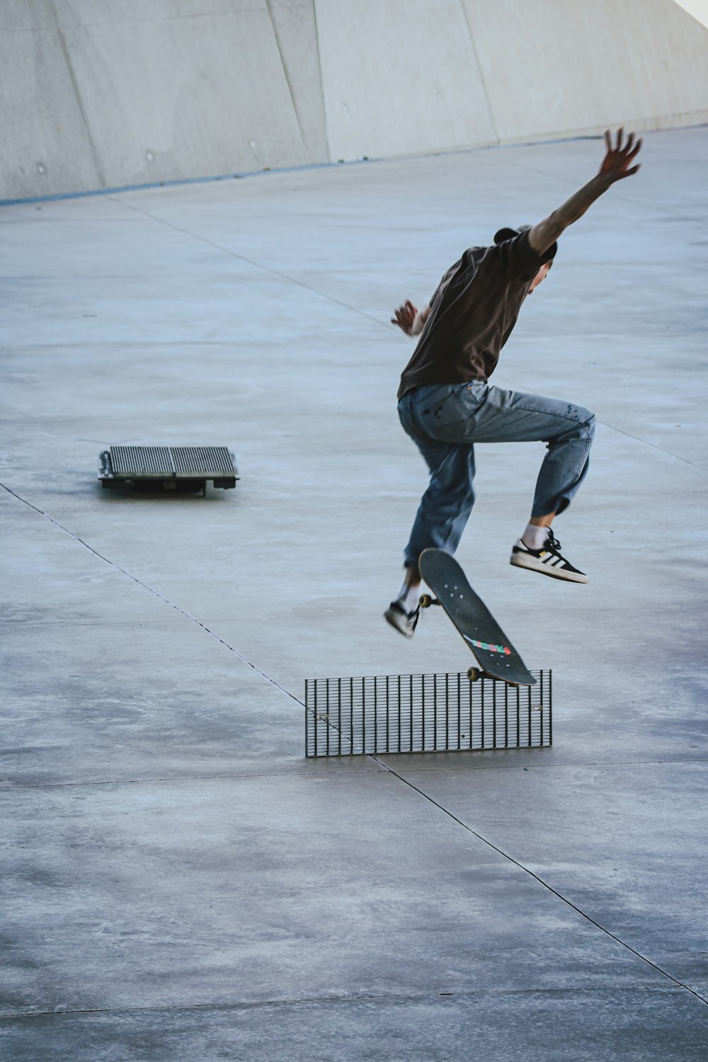 a man jumping in the air with a skateboard