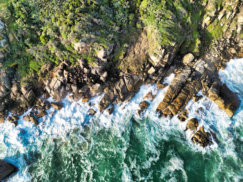 a rocky river with a waterfall