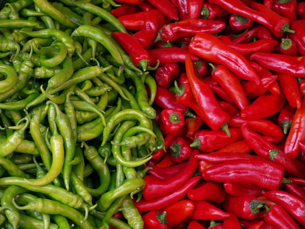 a pile of red and green peppers