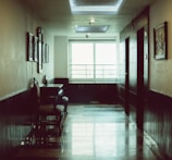 a room with a piano and chairs