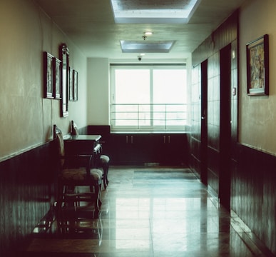 a room with a piano and chairs