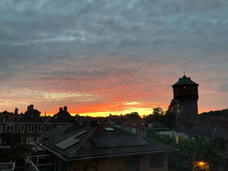 A cinematic still from a videography project showing a dramatic urban landscape at dusk.