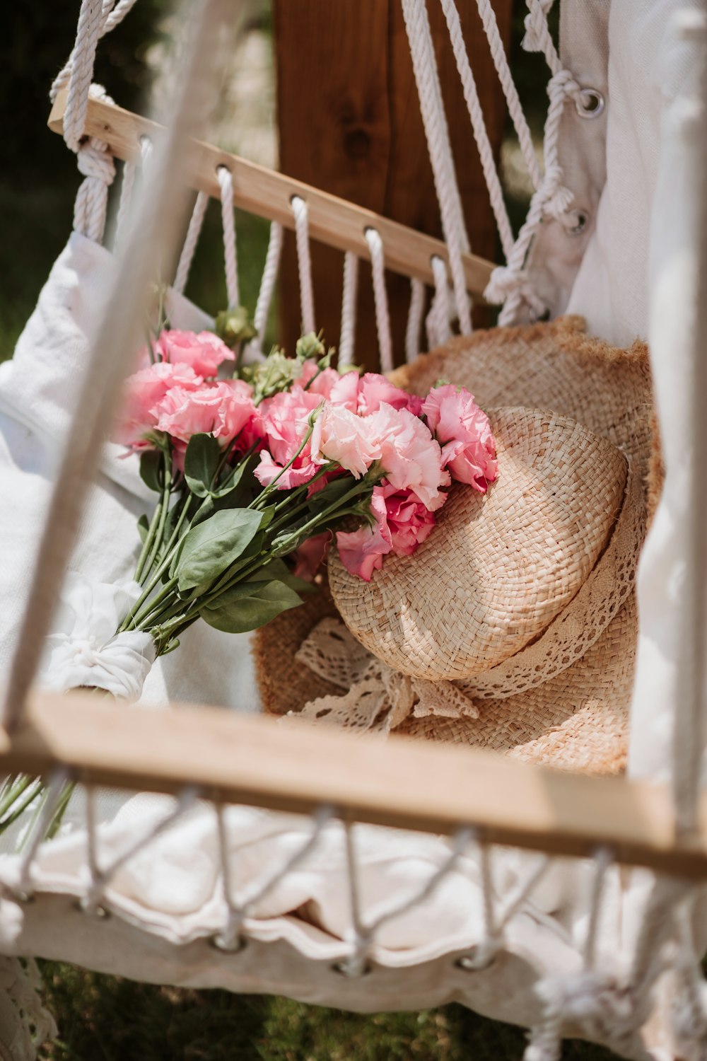 a pink flower on a chair