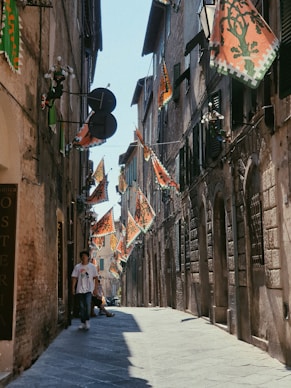 a person walking down a narrow street
