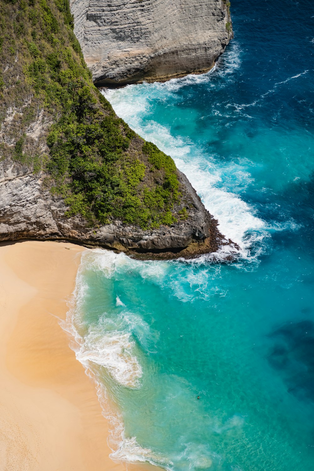 a beach with a rock formation