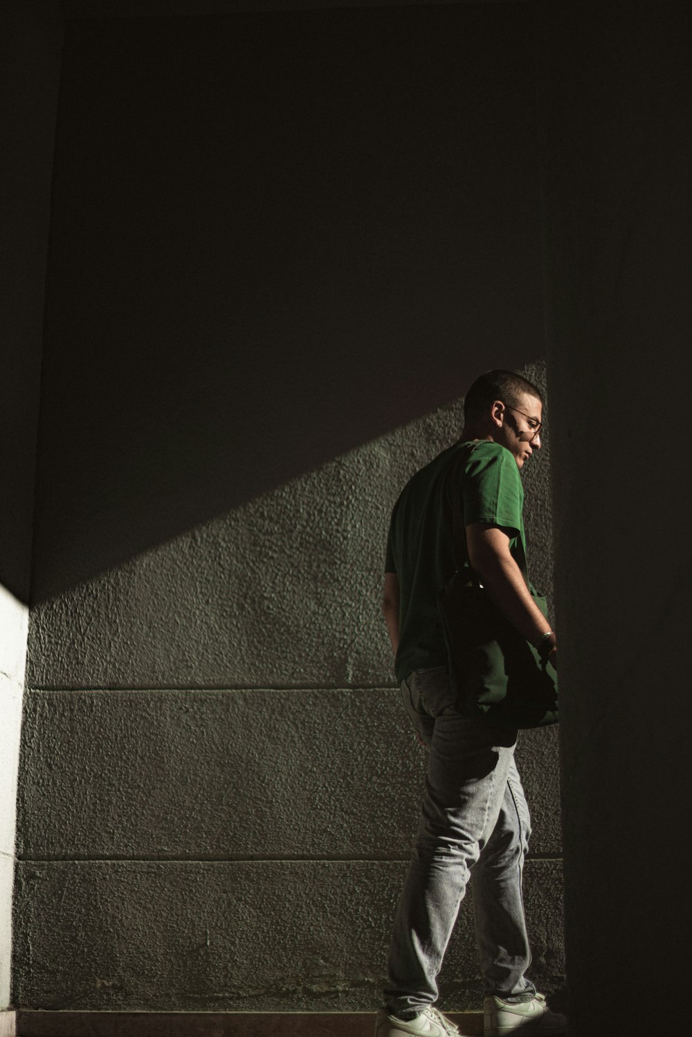 a man standing on a stone wall