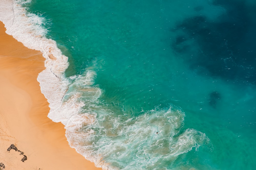 a beach with blue water