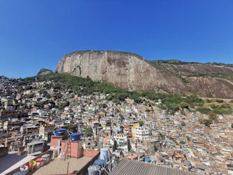 Rio de Janeiro favela beneath a granite mountain, Sugarloaf