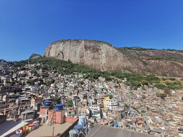 Rio de Janeiro favela beneath a granite mountain, Sugarloaf