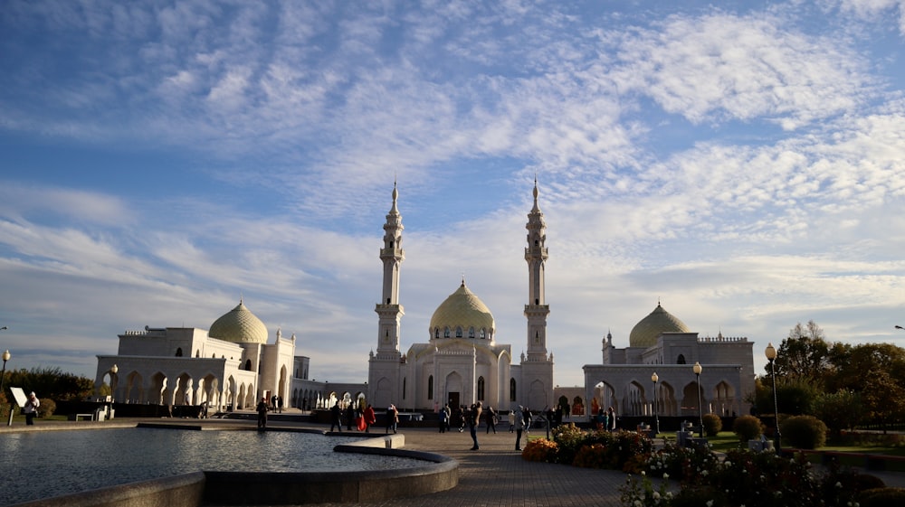 a large white building with towers and domes