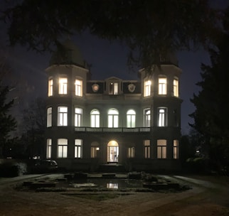 Elegant Langley estate with manicured gardens and a grand entrance under soft evening light.