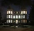 An elegant evening shot of the villa’s exterior, showcasing its grand entrance and lush landscaping under soft lighting.