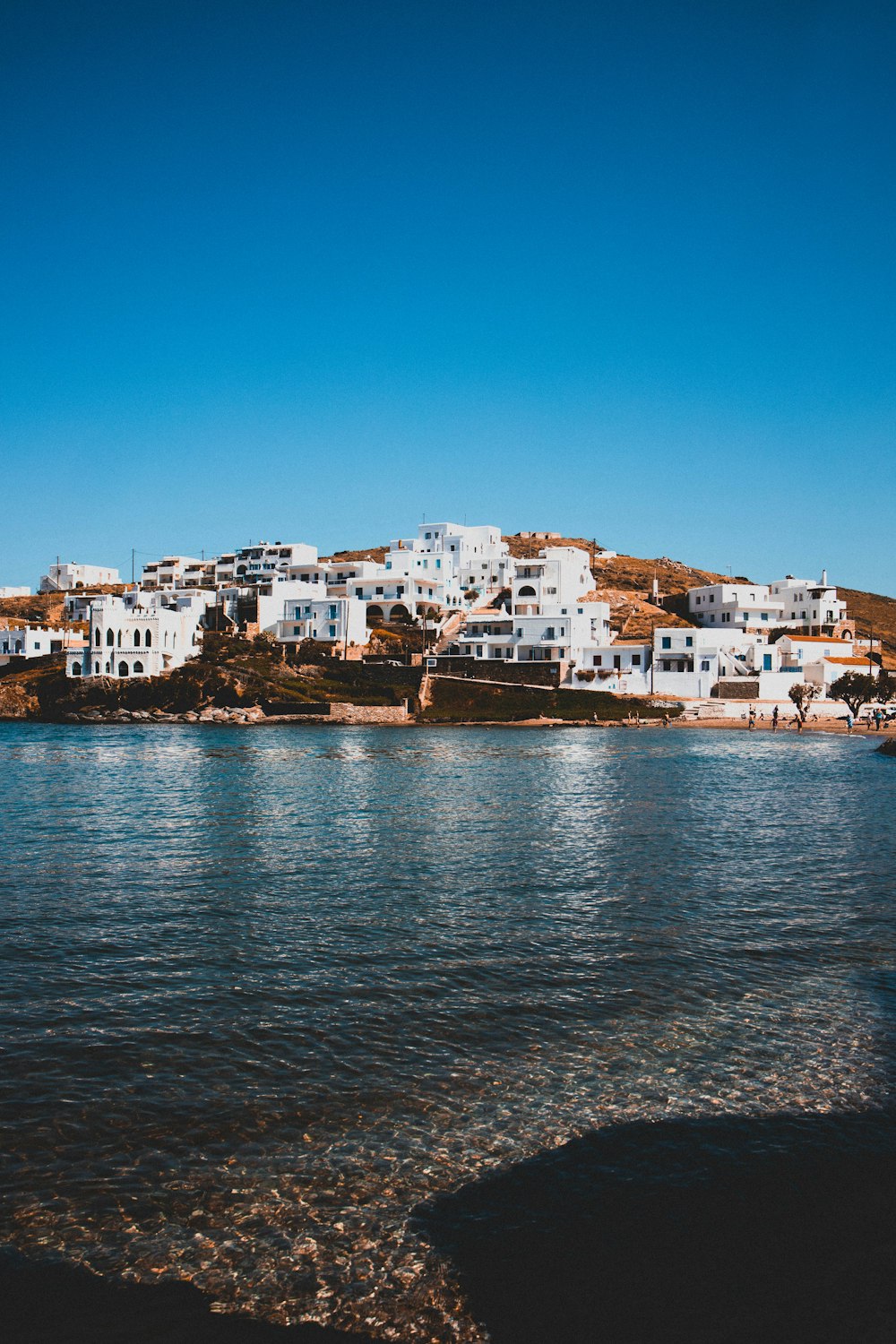 a body of water with buildings along it