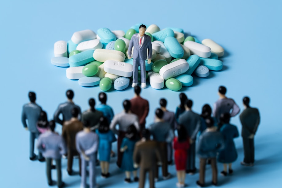 a group of people standing around a person holding a sign