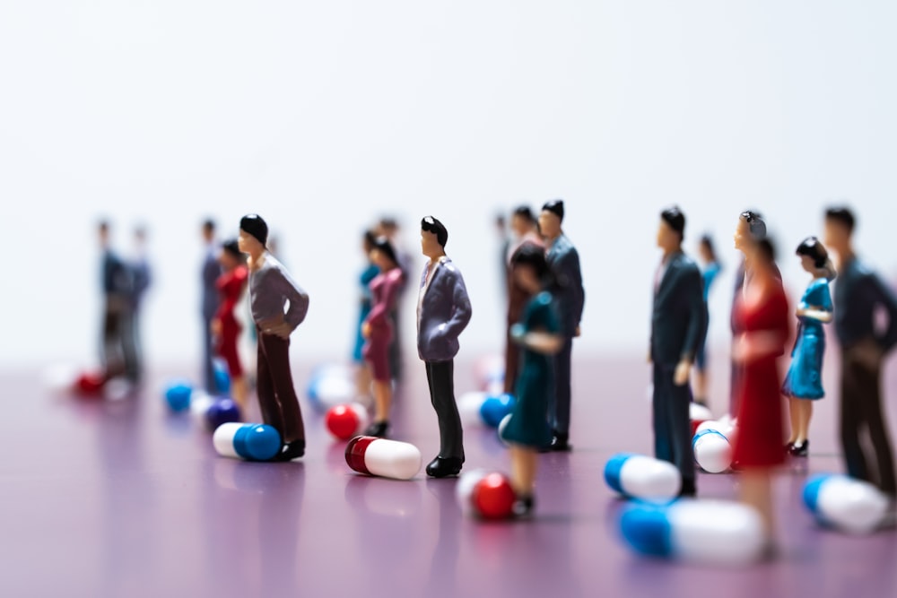 a group of people standing in a room with balls