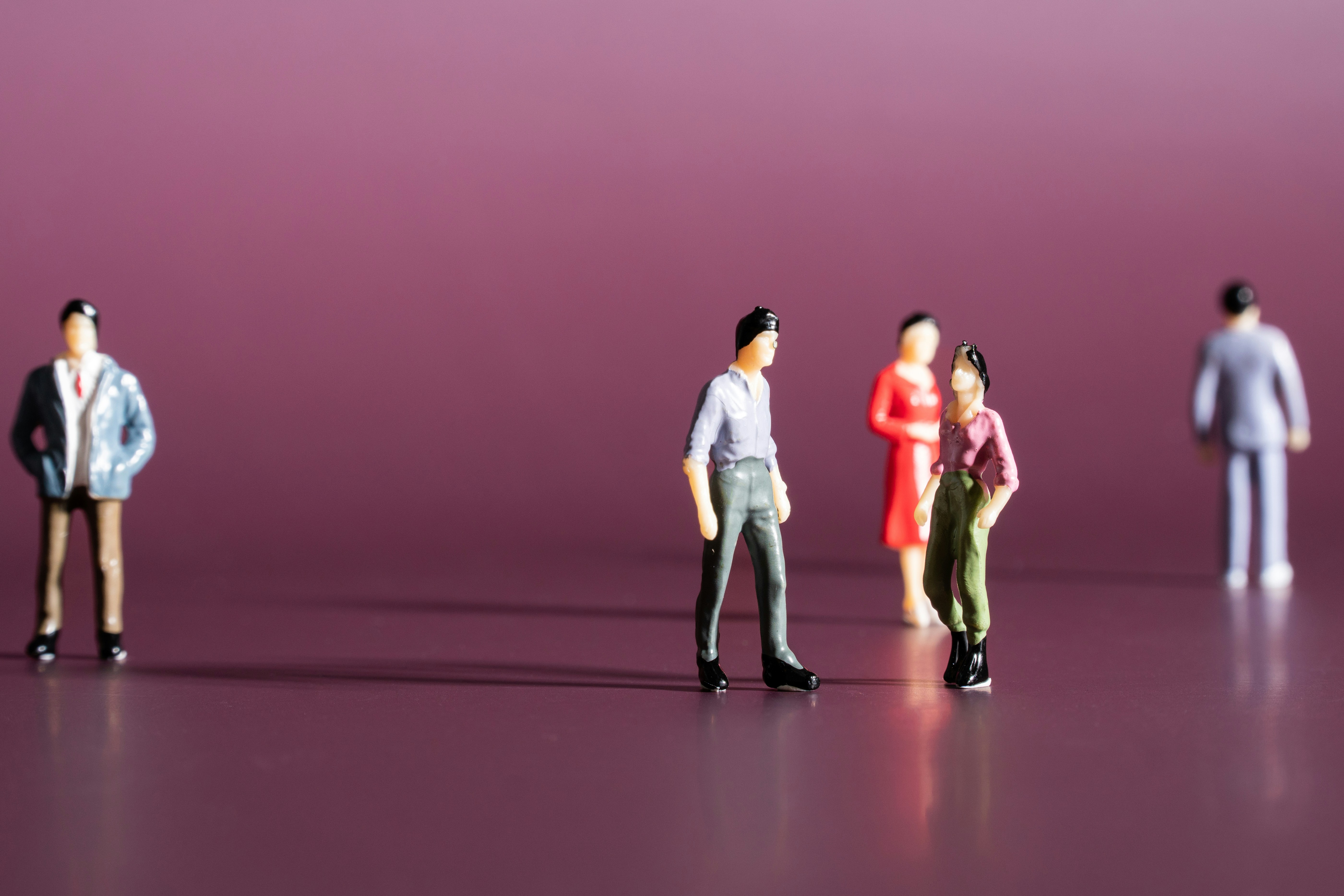 Healthcare disparities concept image showing miniature figures - representing state-by-state maternal mortality and access gaps