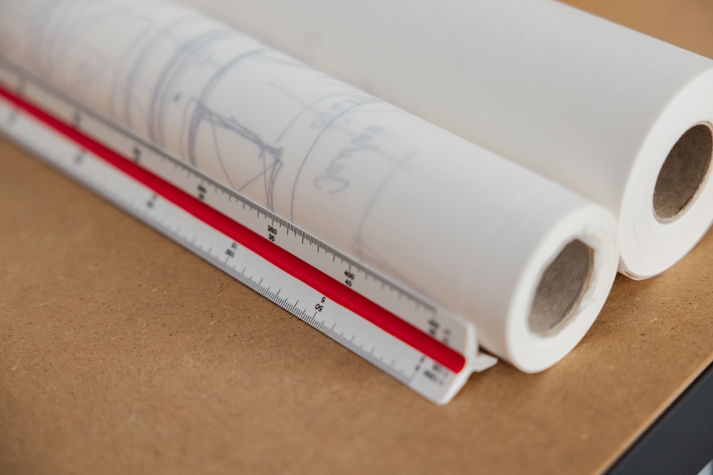 a close-up of a white tube with a red label