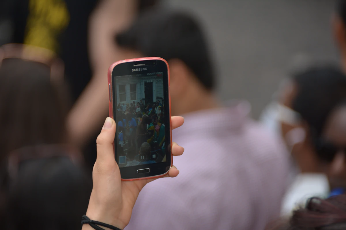 Person holding phone with church app