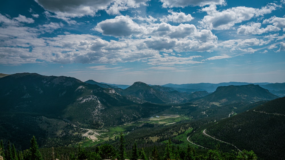 a landscape with mountains and trees