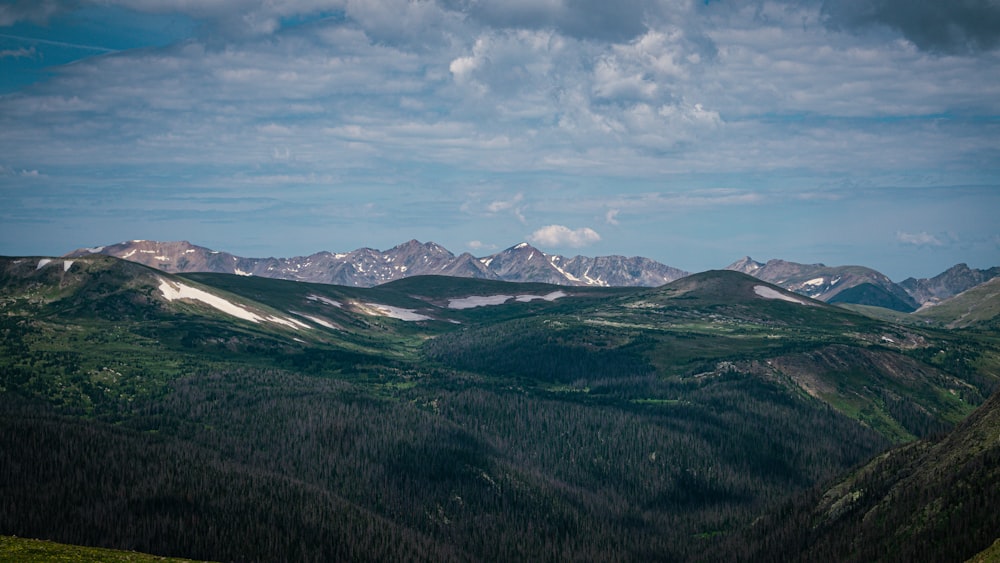 a landscape with mountains in the back