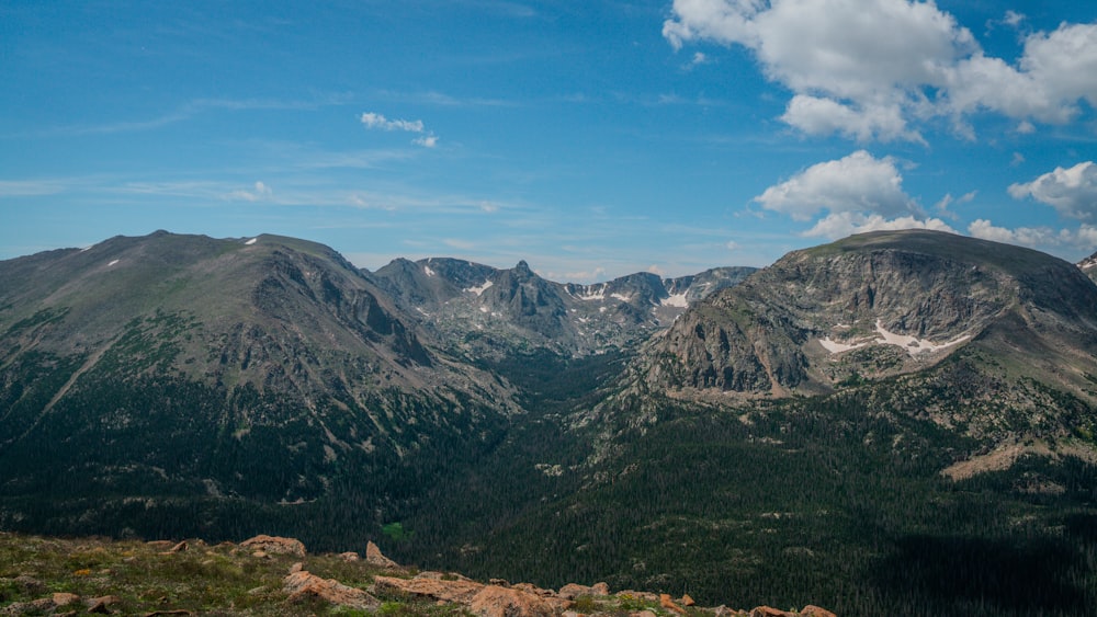 a landscape with mountains in the back