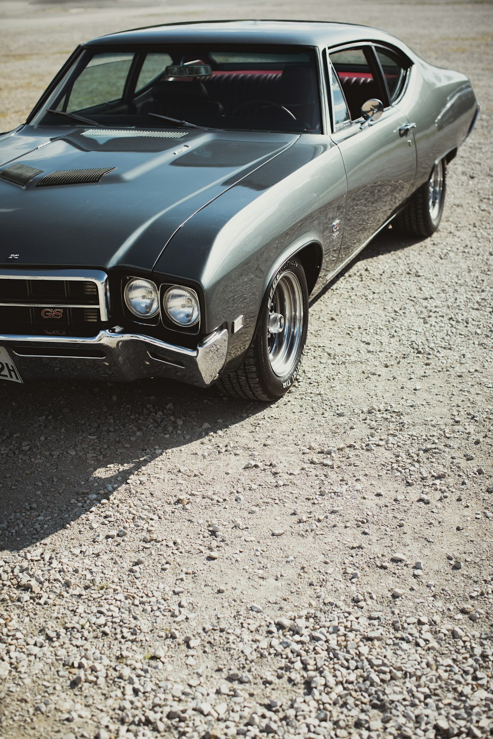 a car parked on gravel