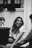 Wendy laughing with friends in a casual outdoor setting
