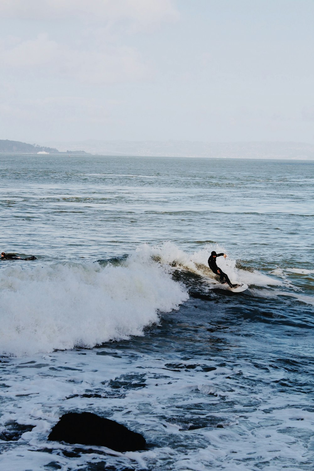 a person surfing on the waves