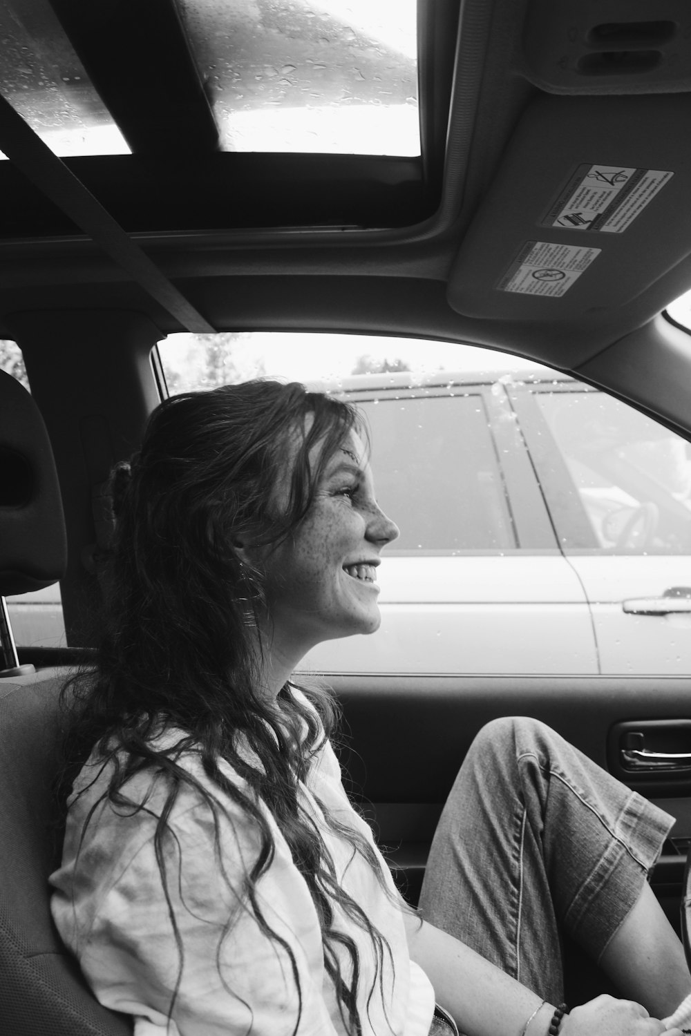 a woman sitting in a car