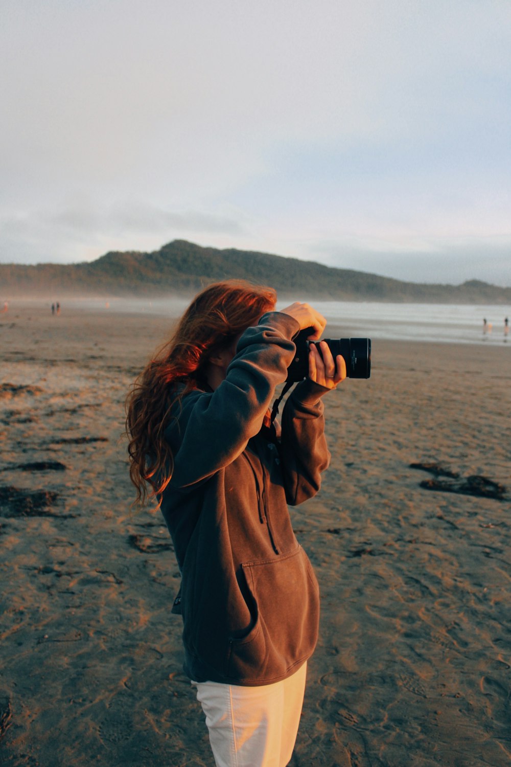 a person taking a picture of the beach