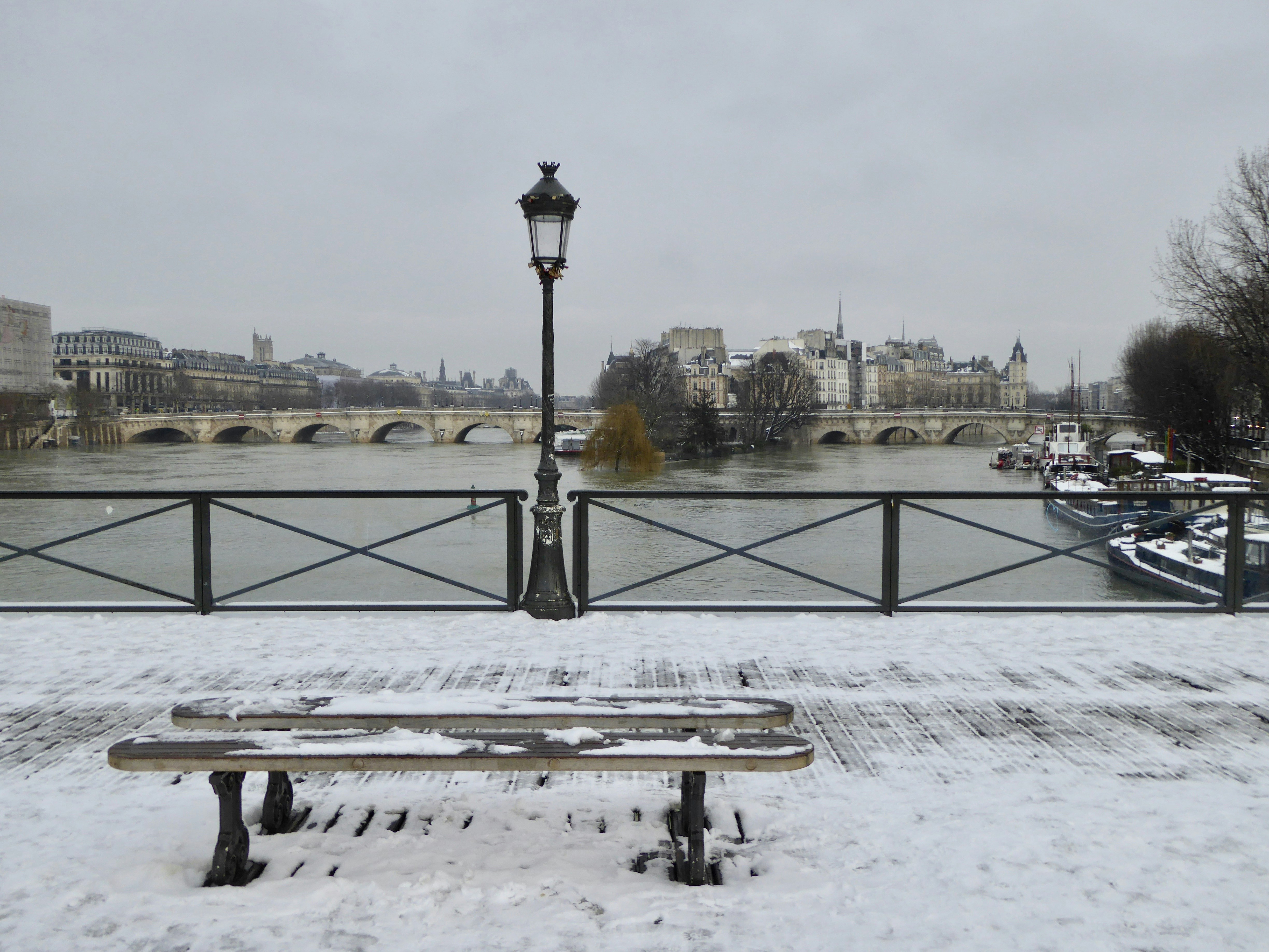 a bench in the snow