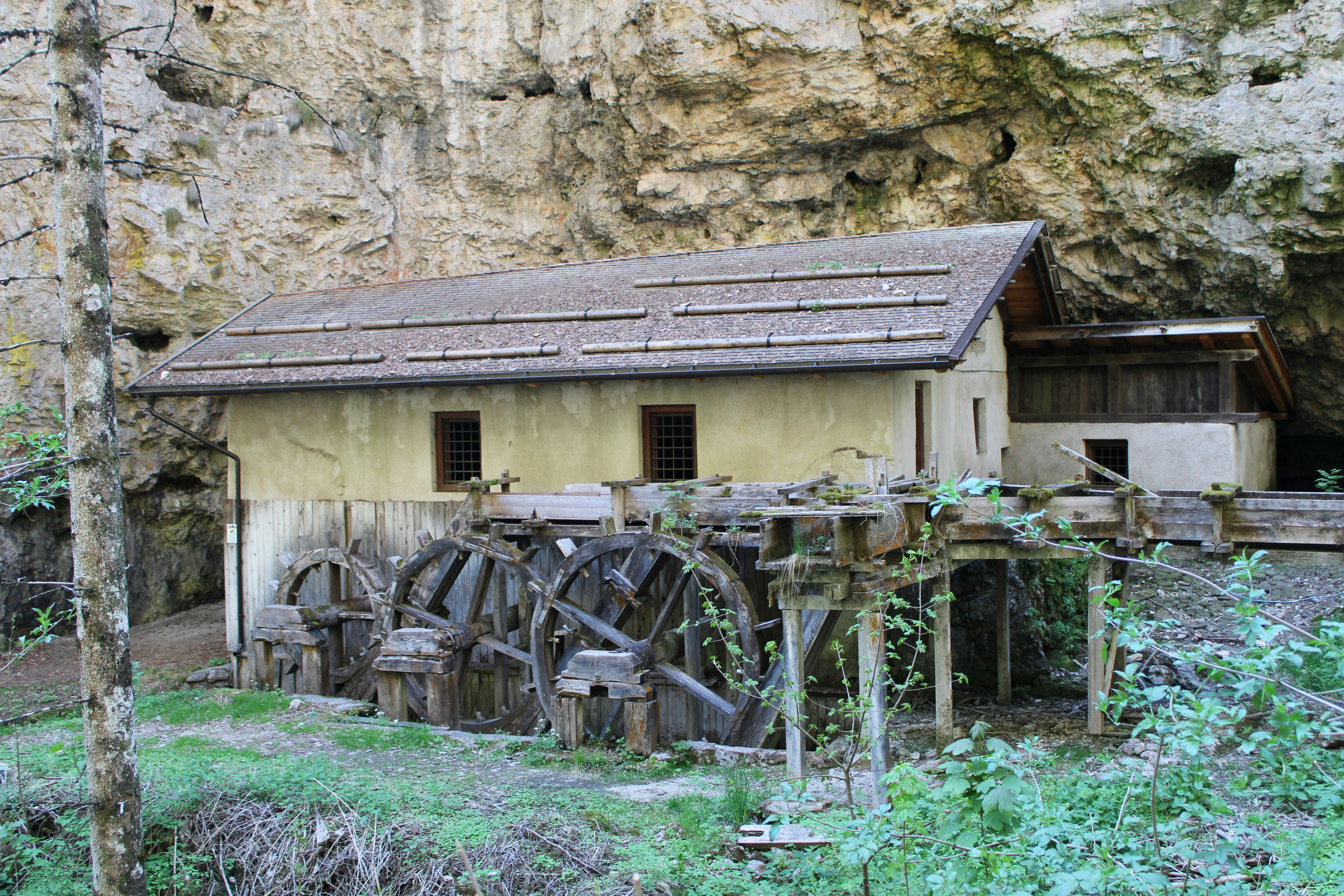 a building with a wheelbarrow in front of it