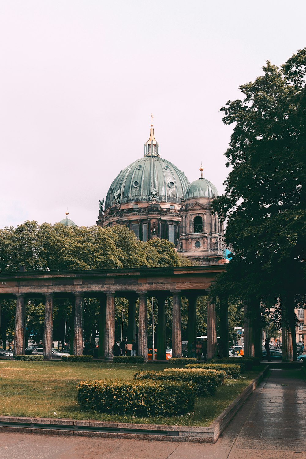 a large building with a dome and columns