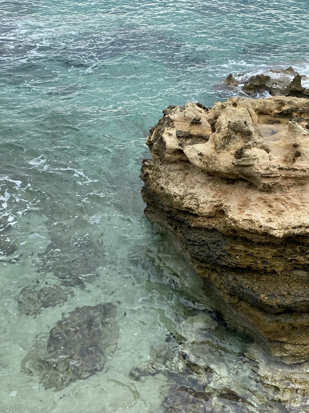 a rocky shoreline with water