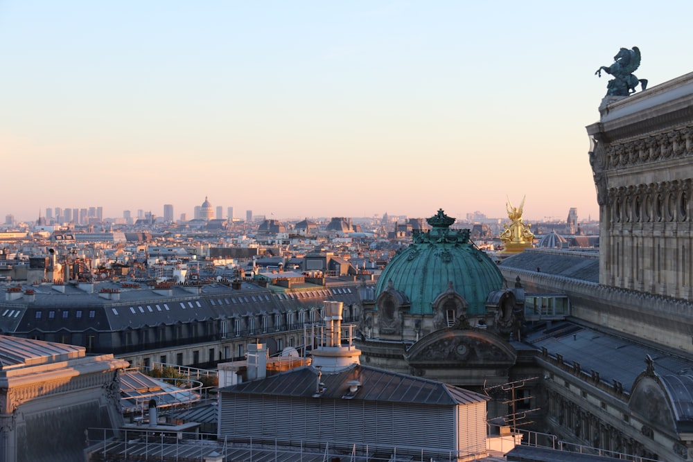 a large city with a statue on top of it