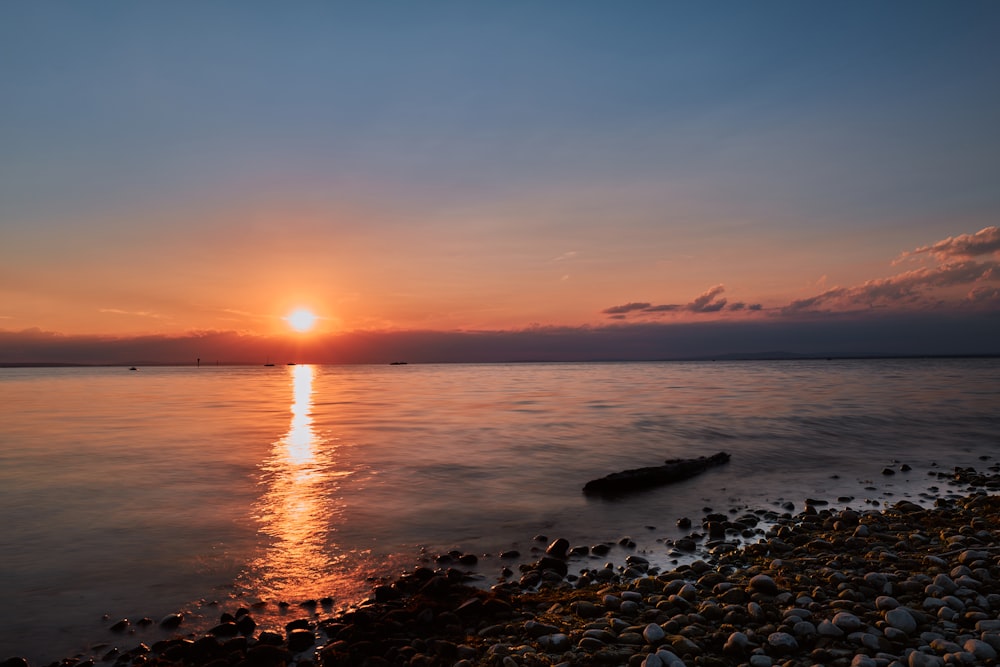 a sunset over a beach