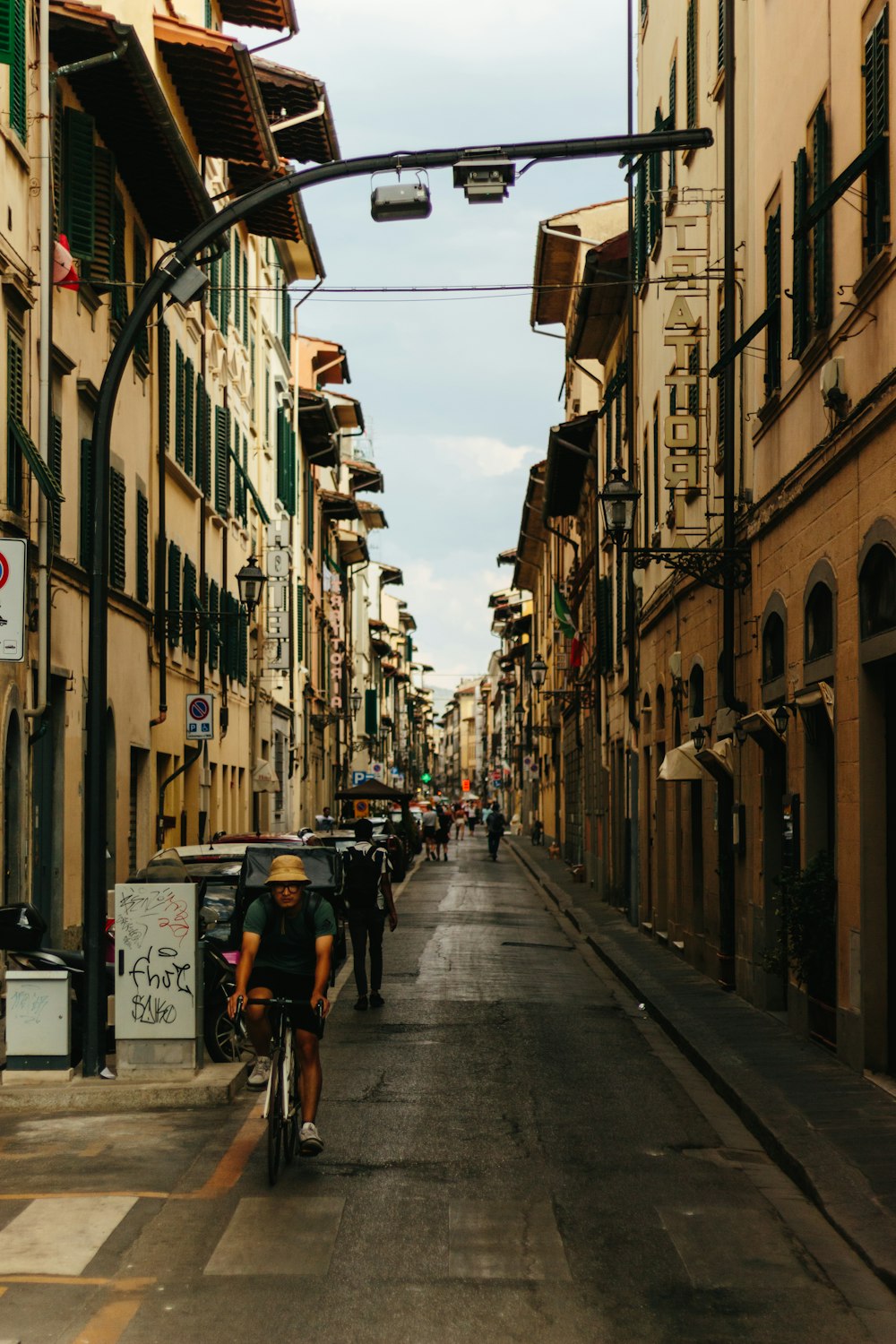 a person riding a bicycle down a street