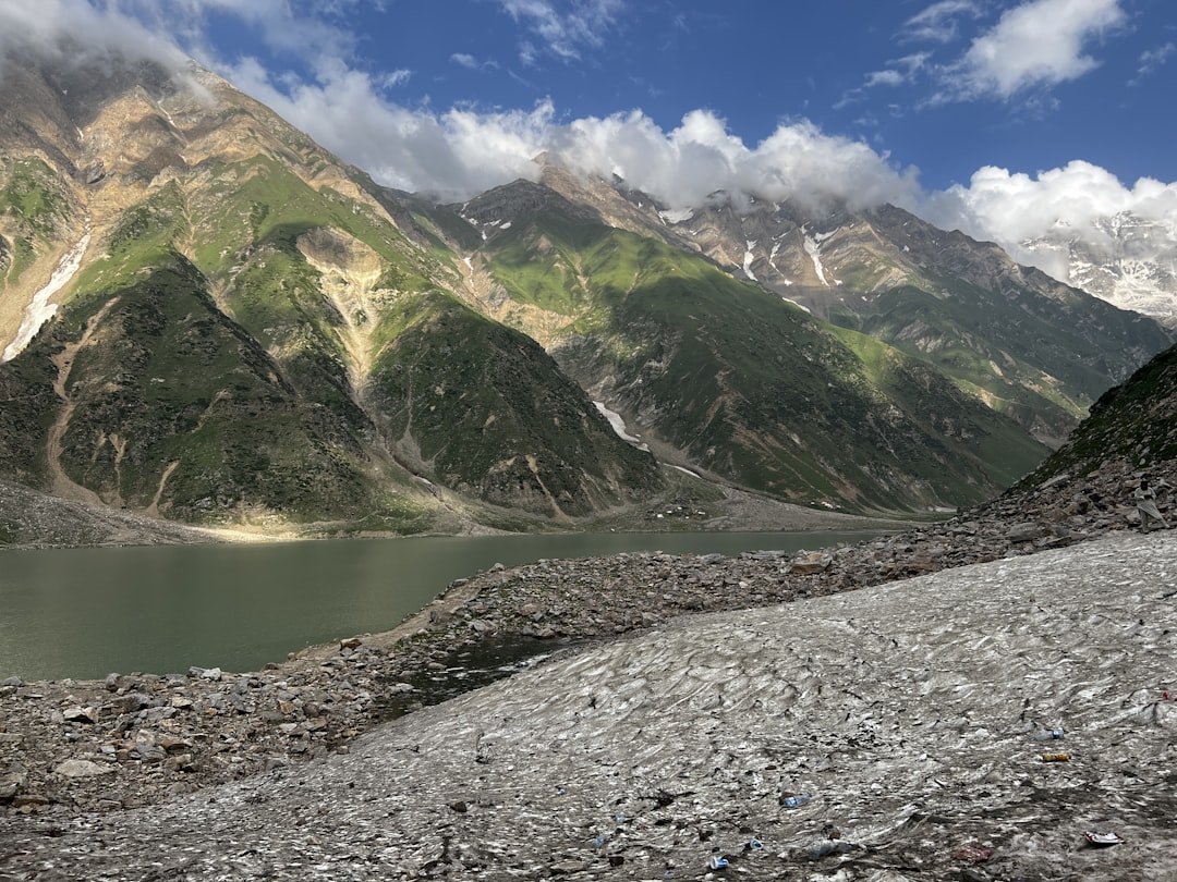 a lake in front of a mountain,