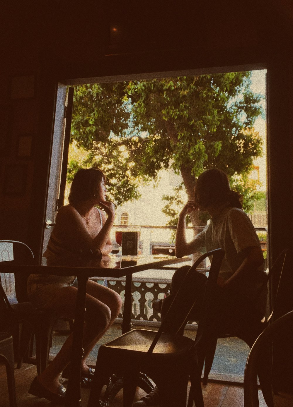 a couple of women sitting at a table