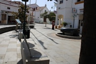 A serene Spanish town square symbolizing calm and trust in the community.